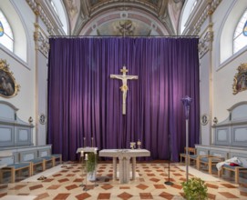 Large purple Lenten cloth in front of the high altar in the baroque parish church of St Nicholas,