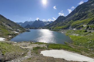 View from Swiss territory to Italian territory over mountain lake Lac du Grand Saint Bernard on top