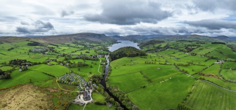 Panorama of Farms and mountains over Ullswater Lake from drone, Pooley Bridge, Lake District