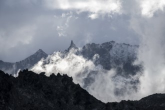 Rocky mountains, pointed ridges with clouds, Valais Alps, Valais, Switzerland