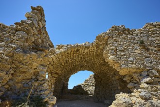 Ancient stone arch under a clear blue sky, Abandoned village, Lost place, Pyli, Paleo Pyli,