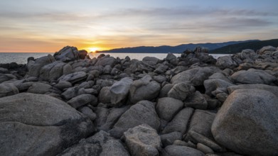 Sunset, rocky coast near Porto Pollo, Corsica, France