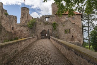Entrance to the partially restored medieval castle ruins of Hanstein on a red sandstone rock,