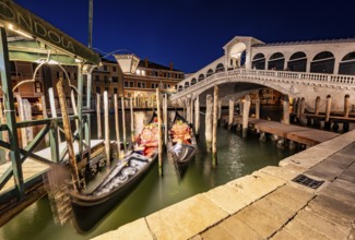 Rialto Bridge and gondolas on the Grand Canal, blue hour, long exposure, Venice, Veneto, Italy