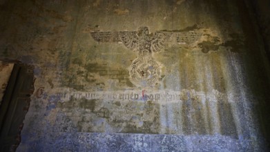 Lost Place, Former Nazi symbol on weathered wall in an abandoned building, Radio Station, WW2,