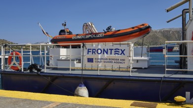 FRONTEX coast guard boat at the dock with orange dinghy on board, Lakki, Leros, Dodecanese, Greek