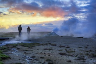 Walkers, sulphur vapour, fumarole, solfataras in the Hveravellir geothermal area, sunset, Icelandic