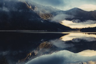 Sunrise with reflections in the Plansee in Tyrol in the Alps in Austria