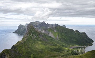 View of mountain peaks on the headland of Fjordgård with peak Segla, fjords Øyfjorden and
