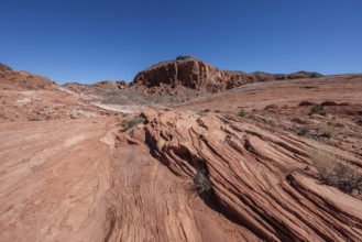 Layered rock formations along the Fire Wave Trail at Valley of Fire State Park near Overton, Nevada