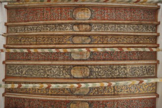 Wooden ceiling with wood carving and painting from the 17th century, interior view, wooden beams,