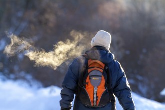 Person walking in very cold weather, Visual effect of the steam seen when exhaling in cold weather.
