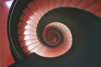 Modern red spiral staircase in an educational building, Zurich, Switzerland
