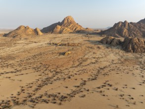 The isolated Spitzkoppe mountain (1728 m) majestically rises above the surrounding desert plains.