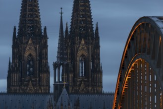 Cologne Cathedral and the Hohenzollern Bridge illuminated with LED lights, Cologne, North
