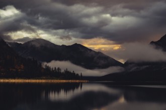 Surreal light atmosphere at sunrise at Plansee, Tyrol, in the Alps in Austria
