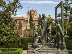 Statue of Johannes von Gott, Granada, royal hospital in the back, Granada, Andalusia, Spain