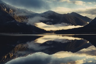 Sunrise with reflections in the Plansee in Tyrol in the Alps in Austria