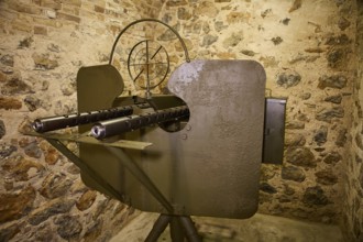 A historical gun mounted on a stone wall, War Museum, Military Museum, Tunnel Museum, Lakki, Leros,