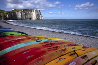 Kayaks, boats, colourful, lying on the beach, pebble beach, rock arch Falaise or Porte d'Aval,