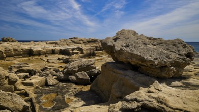 Large rocks along the coast under a clear sky, Oasis Beach, East Coast Rhodes, Rhodes, Dodecanese,