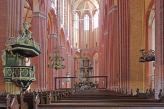 Interior view of the Gothic St. Nikolai Church with pulpit and pulpit bonnet, UNESCO, Brick Gothic,