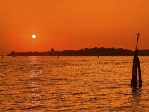 View over the lagoon to Venice at sunset, lagoon city of Venice, Veneto, Italy