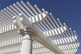Detail abstract of A beautiful marble and wood pergola patio cover