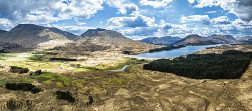 Panorama of Mountains and Moors over Loch Tulla and River Orchy from a drone, Highlands, Scotland,