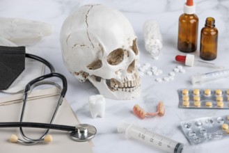 Medical utensils, tablets with skull and teeth