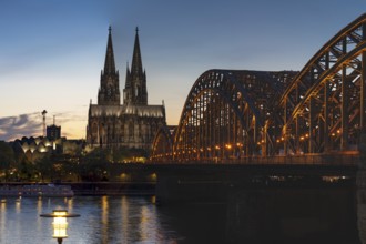 Cologne Cathedral and the Hohenzollern Bridge illuminated with LED lights, Cologne, North