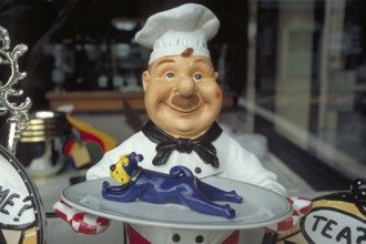Figure of a cook with tray, New York City, USA