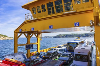 Cars and lorries on a car ferry operating as a floating road, near Lysekil, Bohuslän, Västra