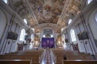 Interior with large purple Lenten cloth in front of the high altar, baroque parish church of St