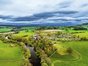 Farms over Ullswater Lake from drone, Pooley Bridge, Lake District National Park, Cumbria, England,