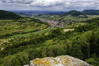 Wide view over the Neidlingen valley with a small village and surrounding hills, Neidlingen