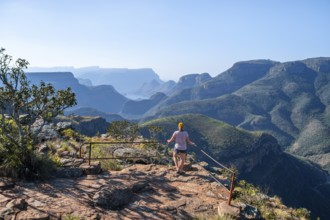 Tourist at the viewpoint, view of the Blyde River gorge, Lowveld Viewpoint, in the evening light,