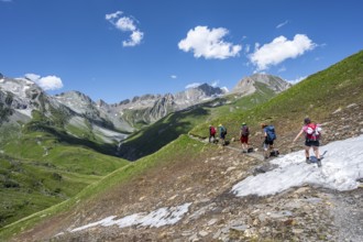 Group of mountaineers on a hiking trail on the Daberlenke, view of rocky mountain peaks in the