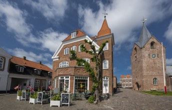 Historic brick building with street café, next to church, Old Town, Ringkøbing, Ringkøbing Fjord,