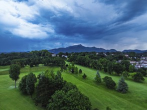 Sunset and storm clouds over Pyrenees and Saint-Jean-de-Luz from a drone, Nouvelle-Aquitaine,