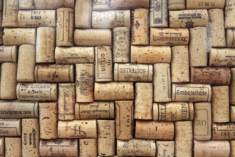 Corks from wine bottles laid as a regular pattern, wine corks, red wine