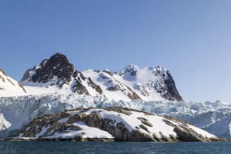 Glacier tongue, ice, edge, rock, mountain peak, sea, Fugelfjorden, Spitsbergen, Svalbard
