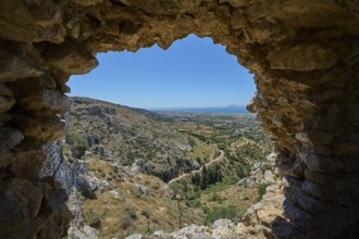 View from a ruined window onto a wide landscape, Abandoned Village, Lost Place, Pyli, Paleo Pyli,