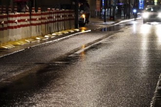 Security barrier for an event, large city at night, Germany