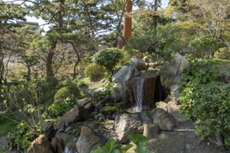Shukkei-en with waterfall at Hakuryu-sen stream, historical Japanese strolling garden, Japanese