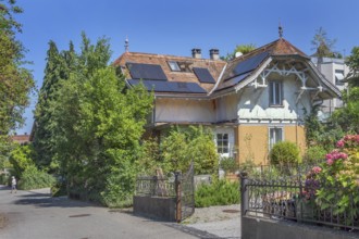 Interesting roof truss of a villa from around 1900, tiled roof with solar panels and a somewhat