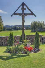 Flower bed with angel and crucifix, Frauenzel, Allgäu, Bavaria, Germany