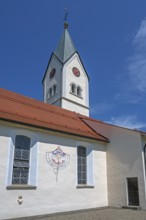 Church of the Assumption of the Virgin Mary with sundial, blue sky, Frauenzel, Allgäu, Bavaria,