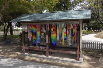 Colourful origami cranes made of paper as a sign of peace in the Peace Park, landmark, UNESCO World