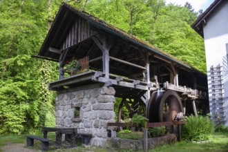 Rustic old mill in the countryside, surrounded by trees and wooden architecture, Stillensteinklamm